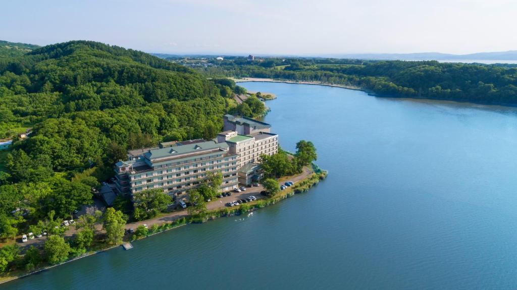 an aerial view of a building on an island in the water at Hotel Abashirikoso in Abashiri