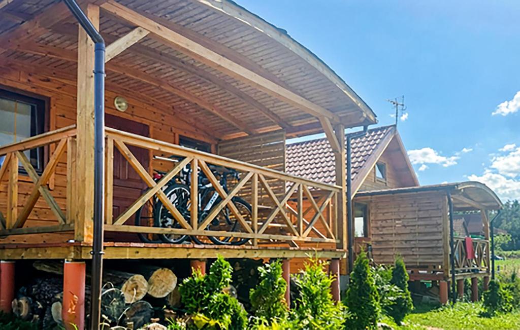 a wooden cabin with awning on the side of it at Gorgeous Home In Rybical With Wifi in Rybical