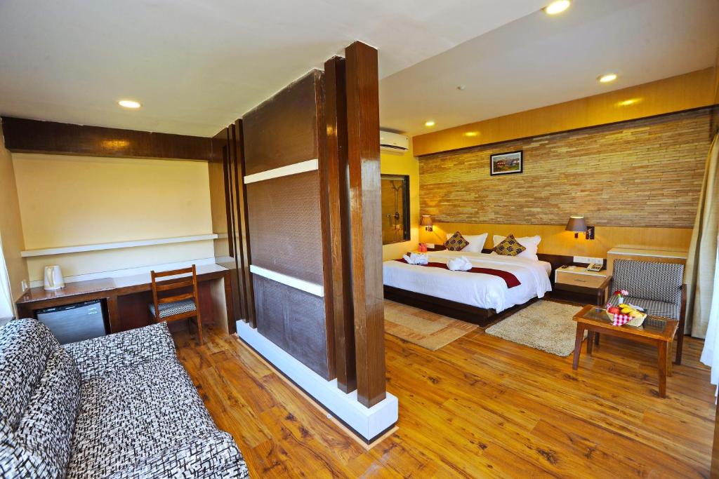 Rúm í herbergi á Hotel Queens Park