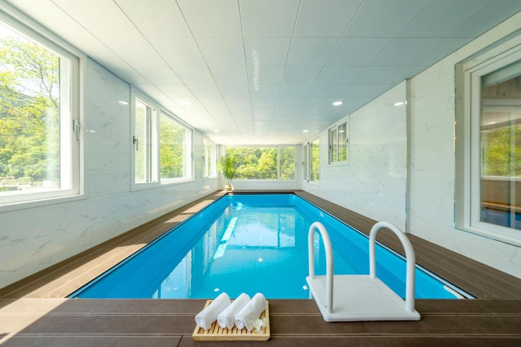 a swimming pool in a house at Chuncheon DBJ in Chuncheon