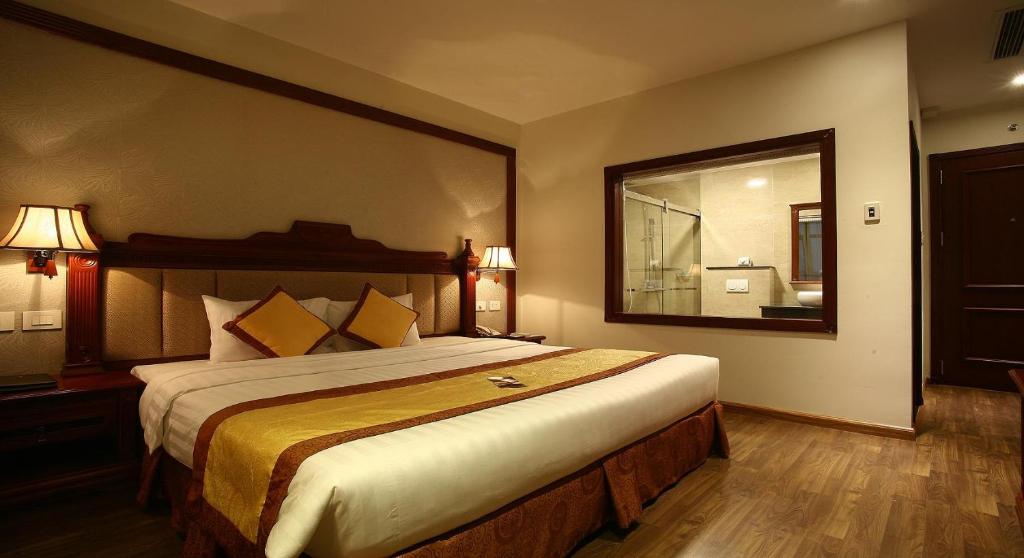 Postel nebo postele na pokoji v ubytování Western Hanoi Hotel
