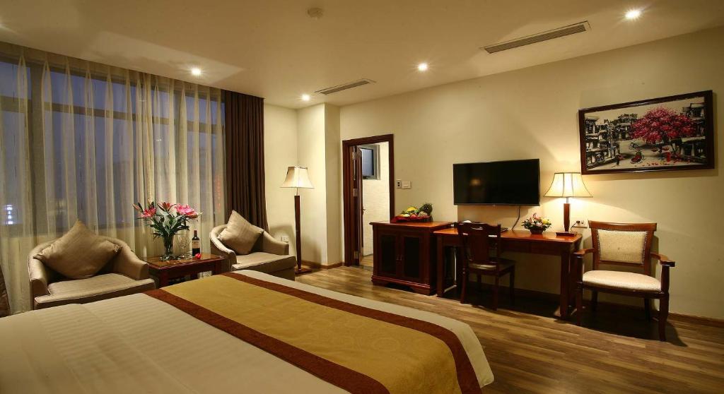 Postel nebo postele na pokoji v ubytování Western Hanoi Hotel