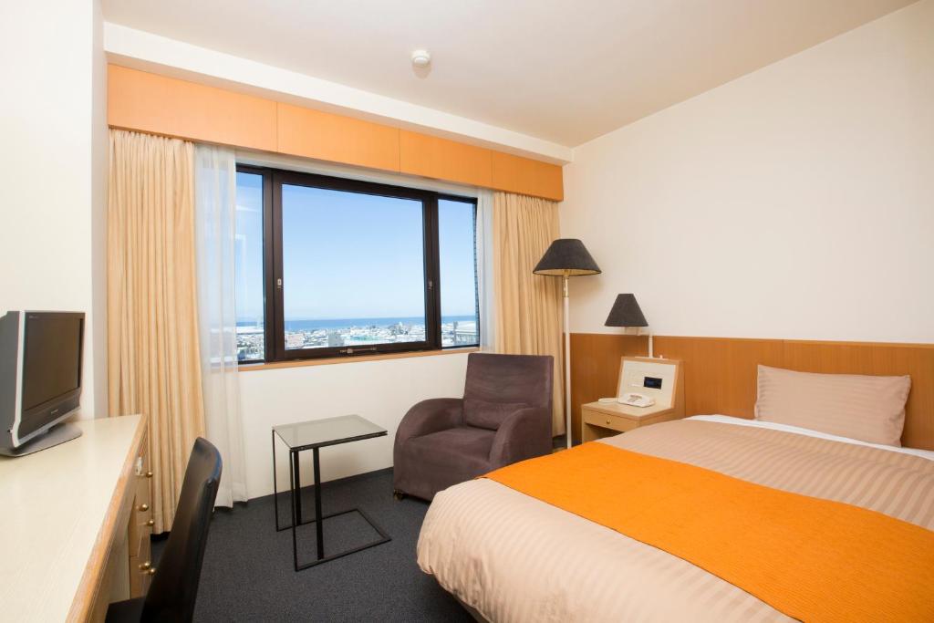 Postel nebo postele na pokoji v ubytování Hotel Granmirage