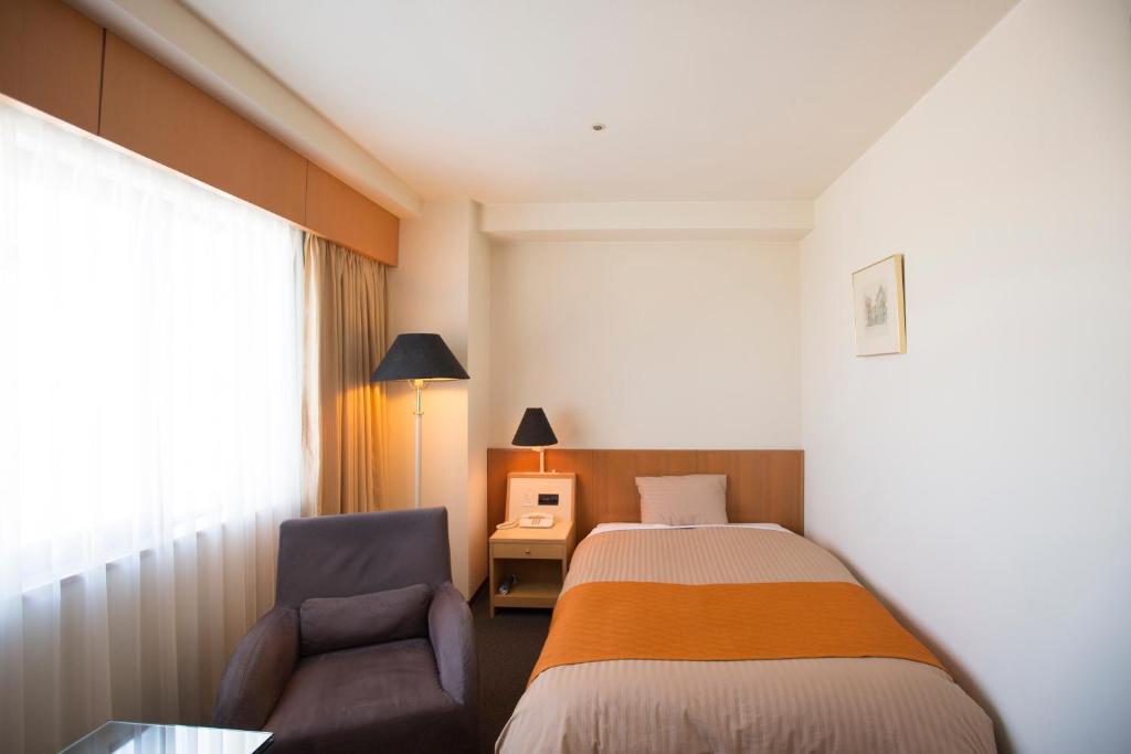 Postel nebo postele na pokoji v ubytování Hotel Granmirage