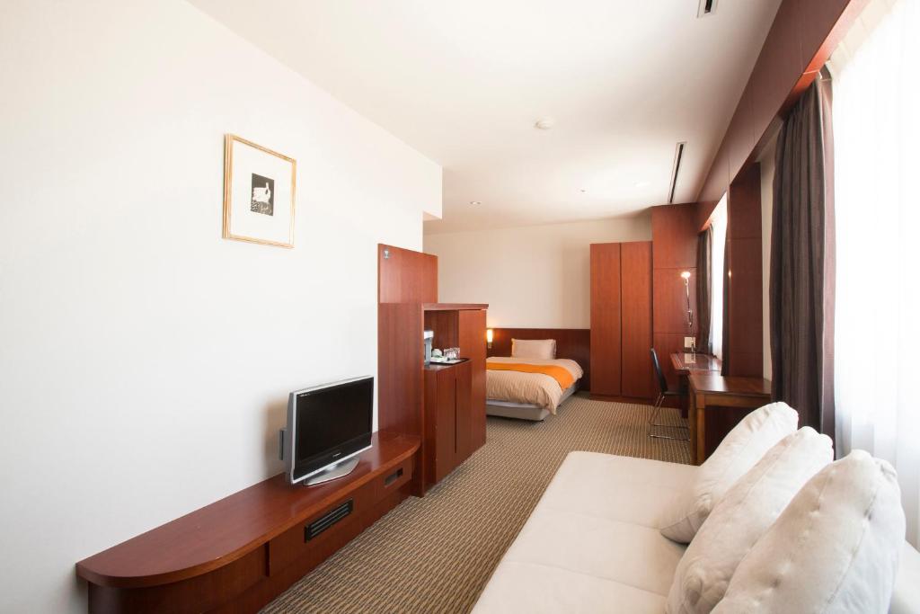 TV a/nebo společenská místnost v ubytování Hotel Granmirage