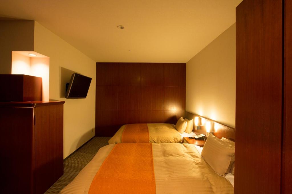 Postel nebo postele na pokoji v ubytování Hotel Granmirage