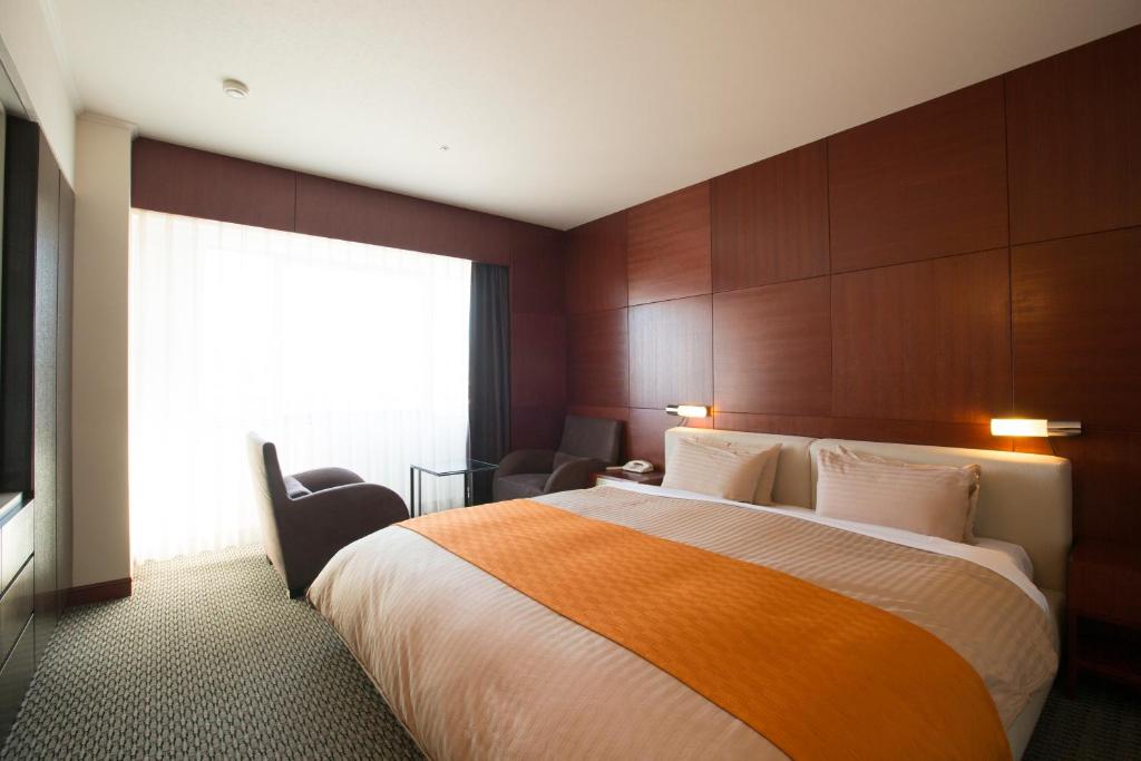 Postel nebo postele na pokoji v ubytování Hotel Granmirage