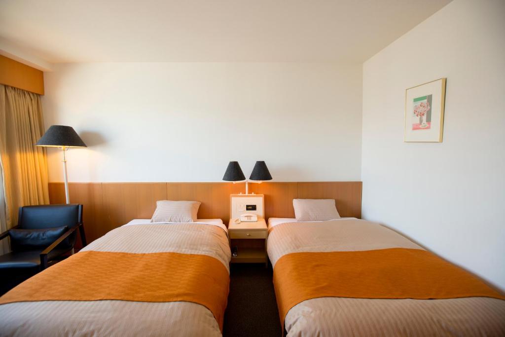 Postel nebo postele na pokoji v ubytování Hotel Granmirage