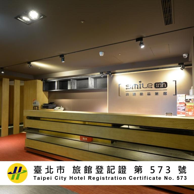 a sign for a hotel hotel registration counter at Smile Inn - Taipei Main Station in Taipei