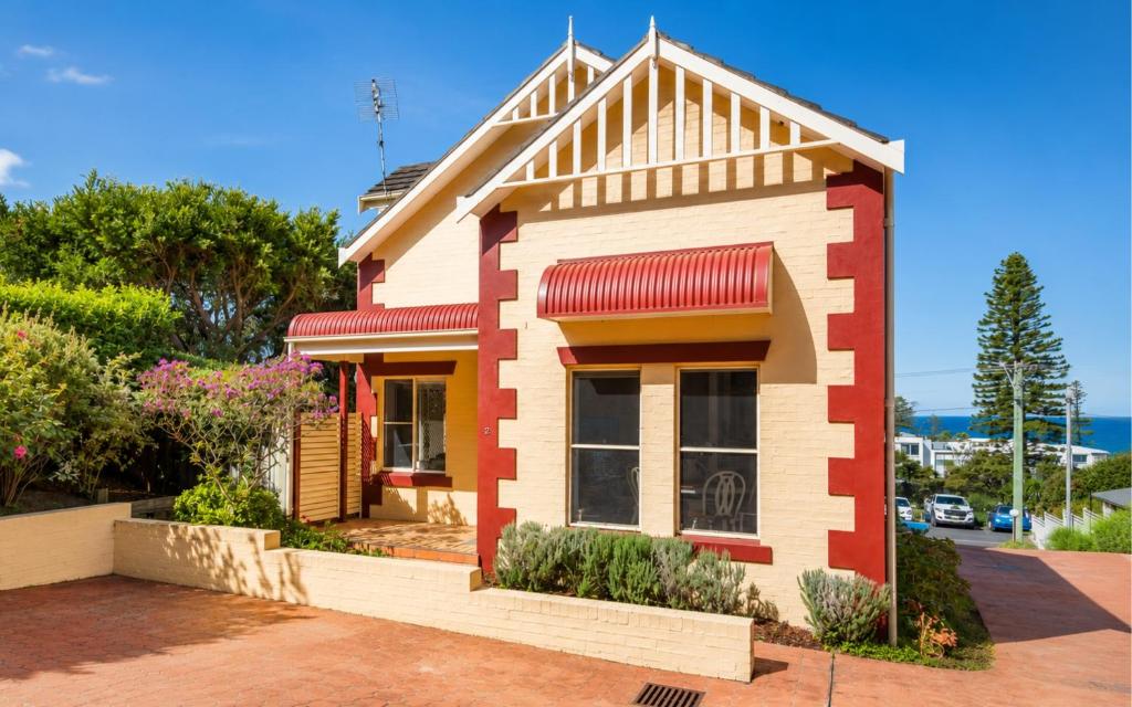 a small house with red and white at Ocean Tracks in Kiama