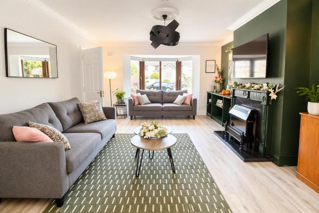 a living room with a couch and a table at Ardee Retreat - Sleeps 6, Garden, Walk to Town in Ardee