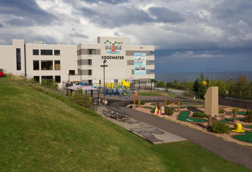 a large building with a playground in front of it at Edgewater Hotel and Waterpark in Duluth