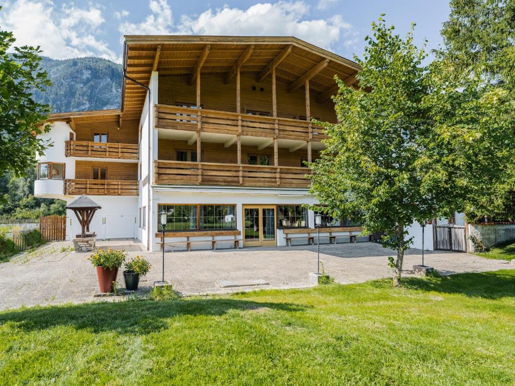 a large building with benches in front of it at Chalet in Angerberg near SkiWelt Slopes in Angerberg
