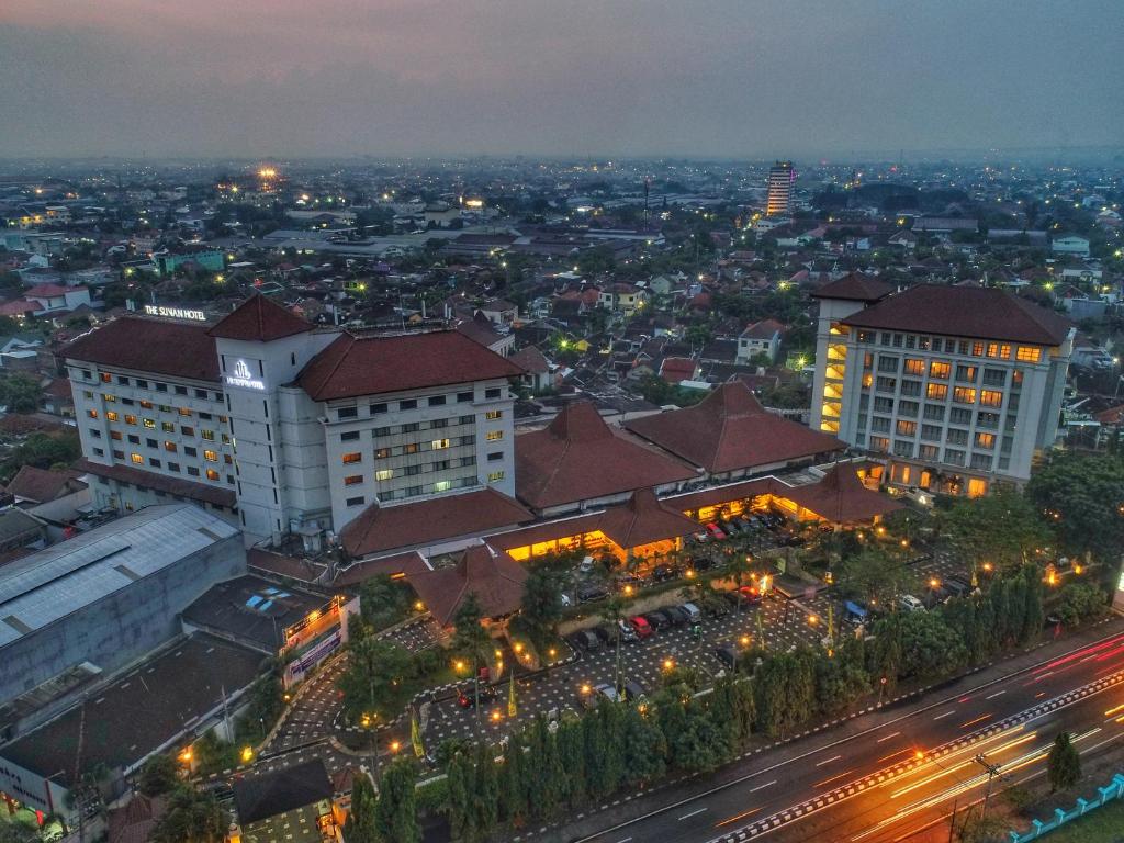 an overhead view of a city at night at The Sunan Hotel Solo in Solo