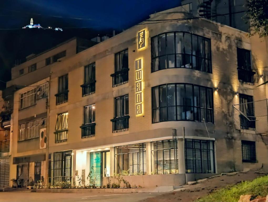 a building with a sign on the side of it at Iwana stay in Bogotá