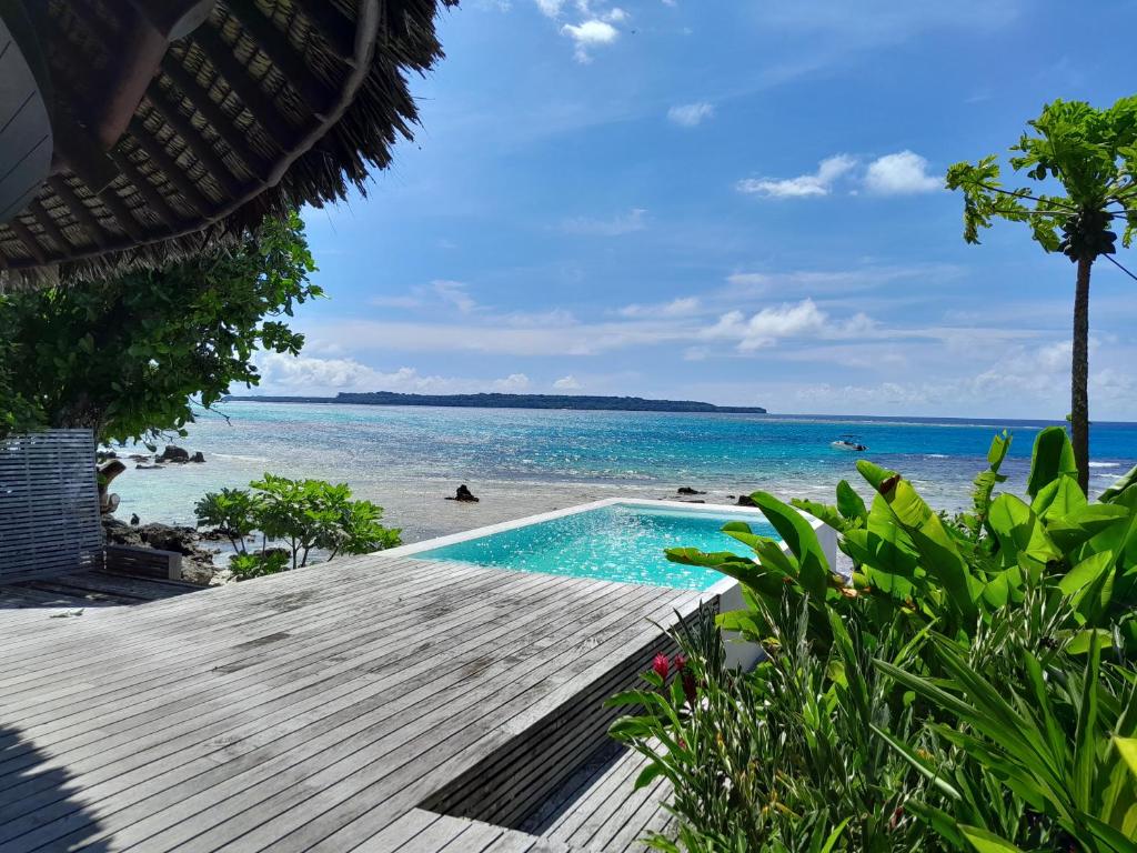 a view of the beach from a resort with a swimming pool at Black Pearl Resort in Espiritu Santo