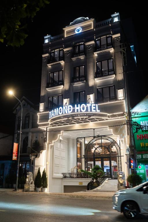 a building with a sign that reads banquet hotel at night at Diamond Hotel Yen Bai in Yên Bái