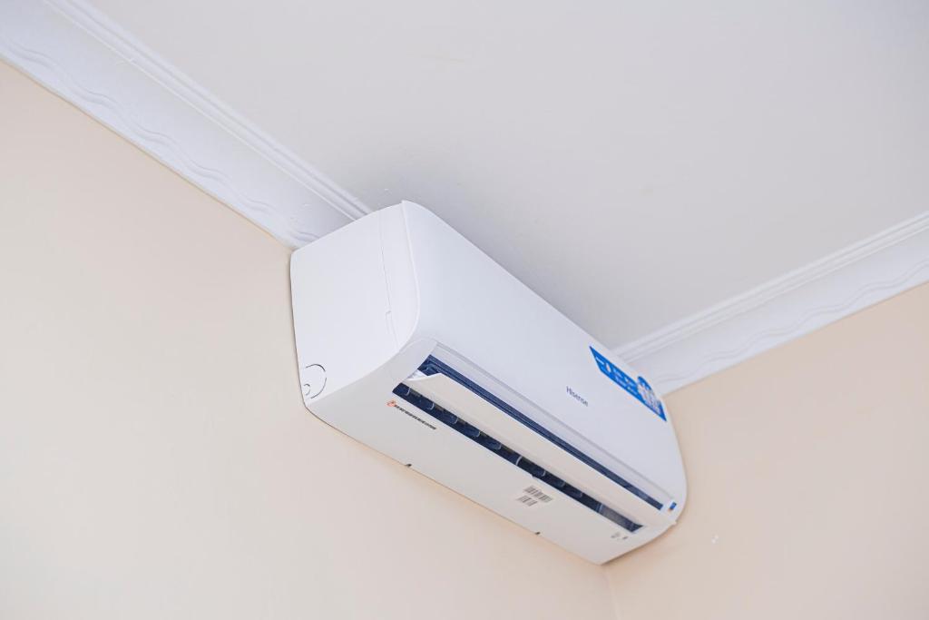 a white object on the ceiling of a room at CAM Apartments in Dodoma