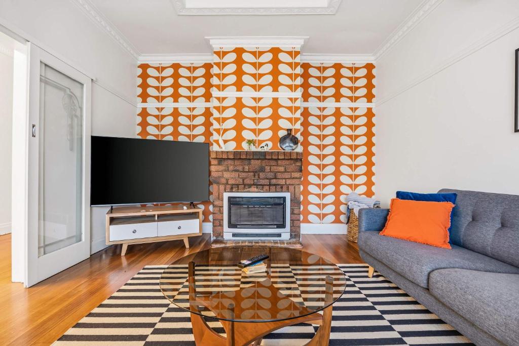 a living room with a couch and a fireplace at Brighton Belle Stawell in Stawell