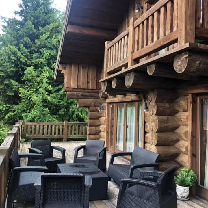 a group of chairs and tables on a patio at Chalet Vancouver in Donovaly
