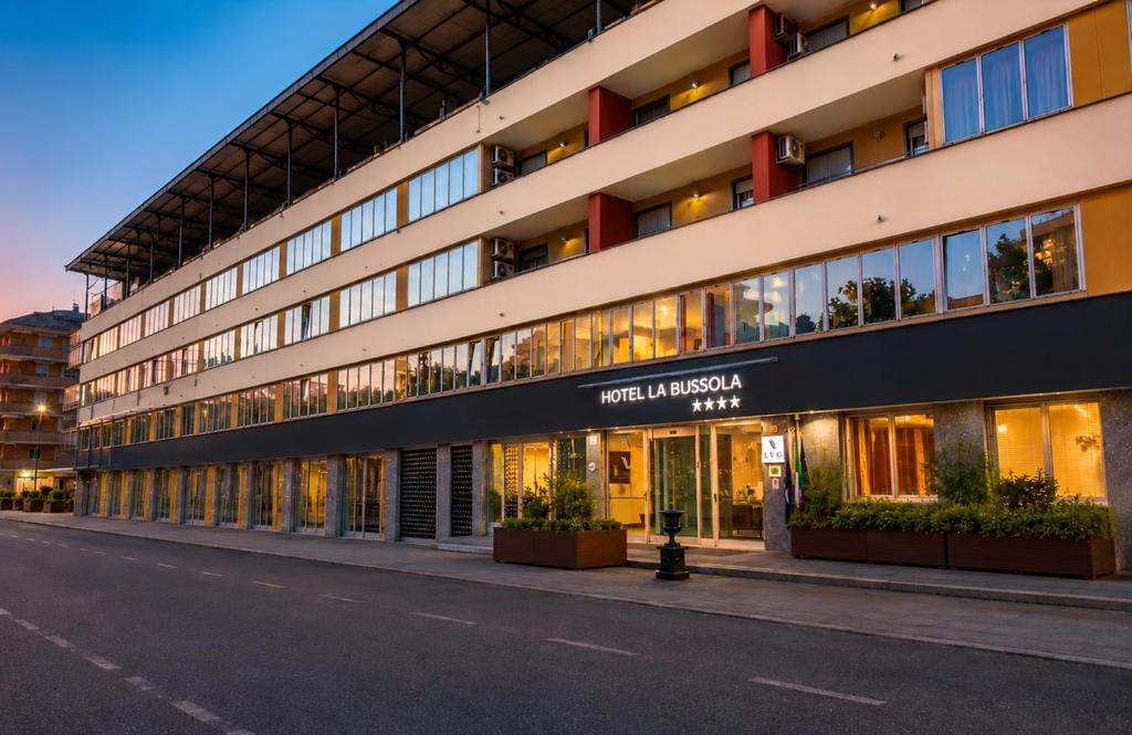 a facade of a hotel in a street at LVG Hotel Collection - La Bussola in Novara