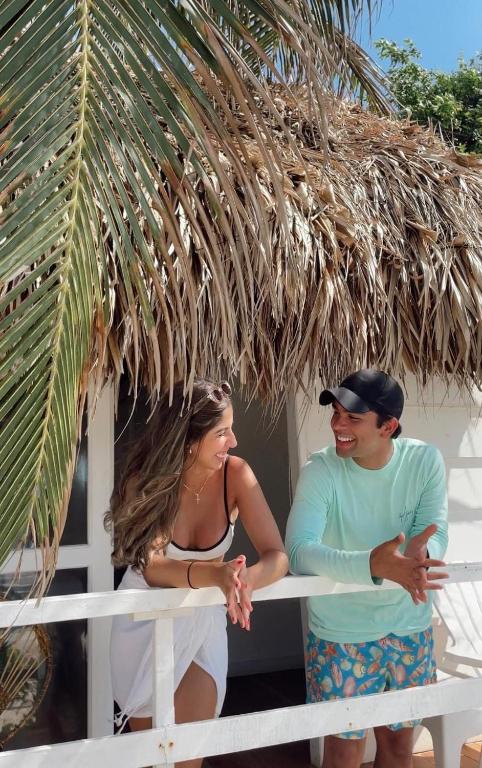 two women standing in front of a hut at Marine Beach Hotel in Cartagena de Indias