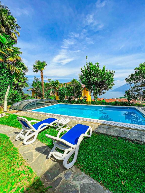 two lounge chairs and a swimming pool at Casa Lago in Germignaga