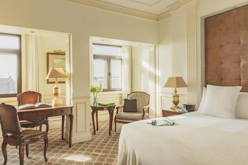 a hotel room with a bed and a desk and a computer at Hotel Fénix, a Gran Meliá Hotel - The Leading Hotels of the World in Madrid