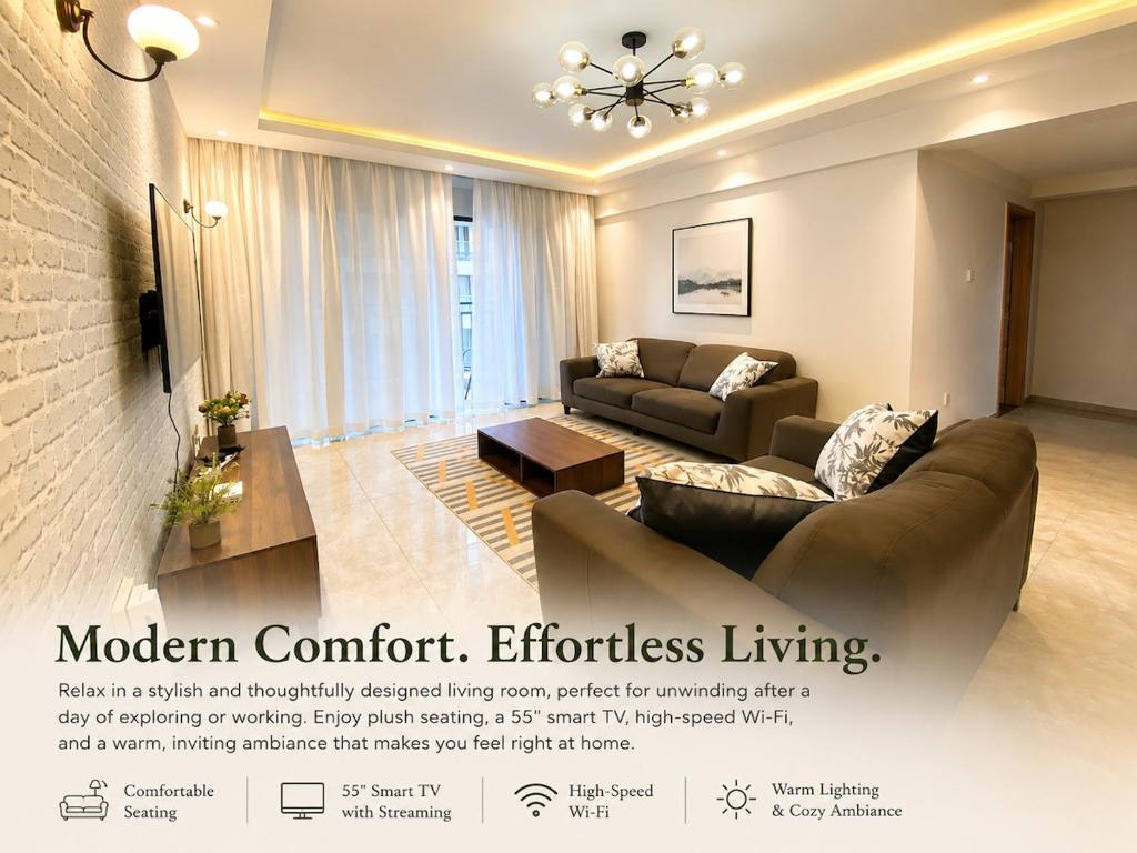 a living room with a couch and a table at 3 bedroom ensuite apartment Lavington in Nairobi
