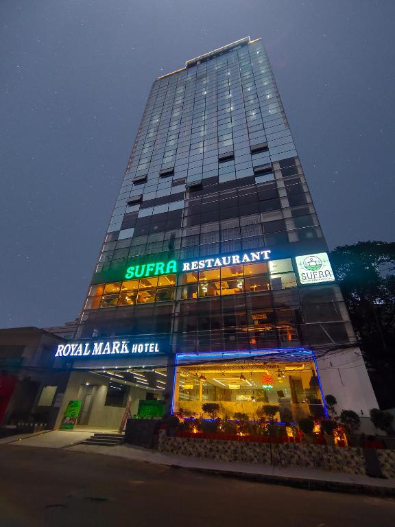 a building with a store in front of it at Royal Mark Hotel in Sylhet