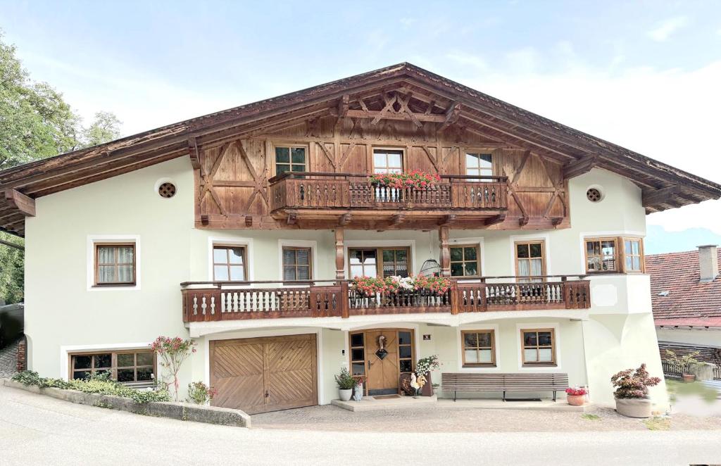 a house with a balcony on top of it at Ferienwohnung Stern, Natters in Innsbruck