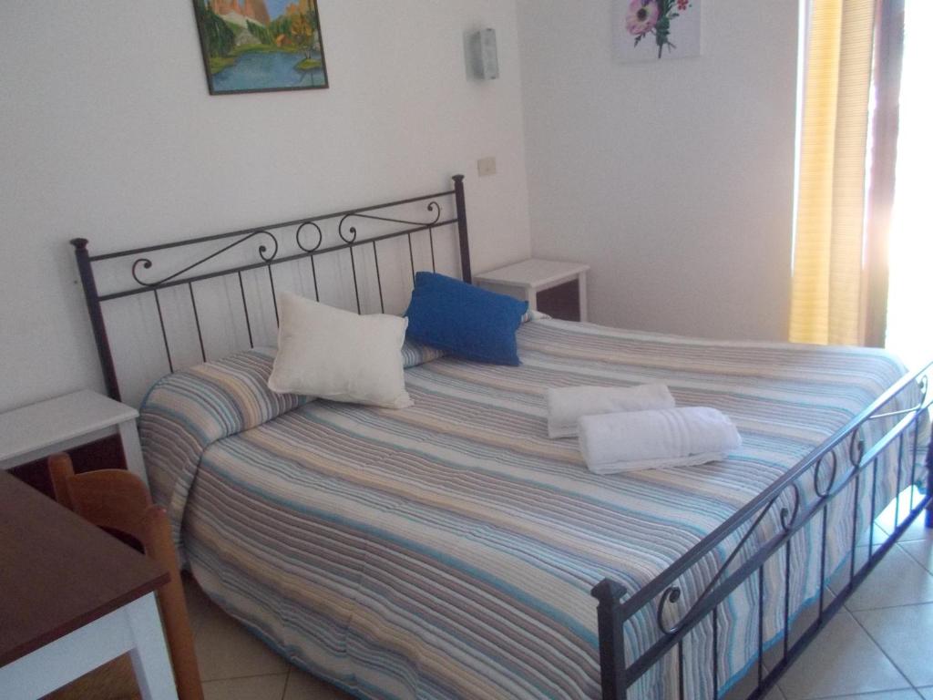 Postel nebo postele na pokoji v ubytování Hotel Mastropeppe
