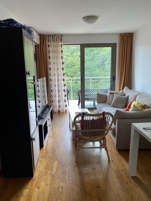 a living room with a couch and a table at Eva in Pržno