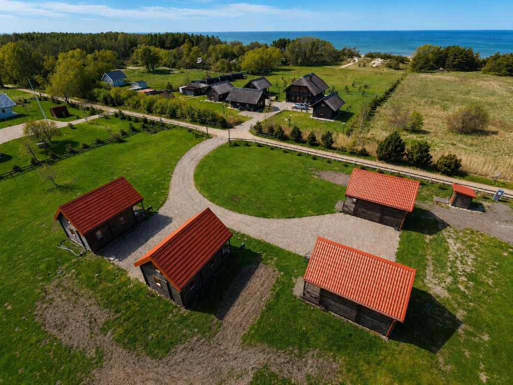 an overhead view of a group of houses with red roofs at KOPA LIVING seaside holiday homes in Nida