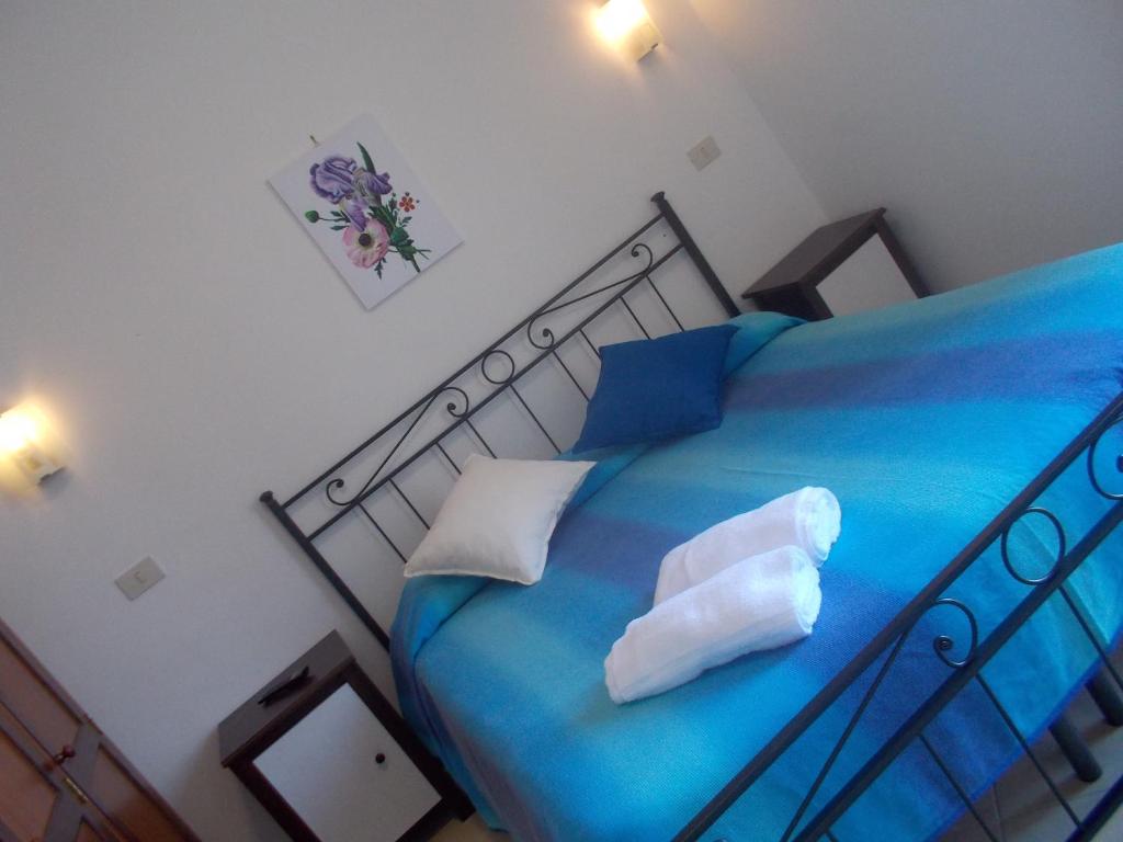 Postel nebo postele na pokoji v ubytování Hotel Mastropeppe