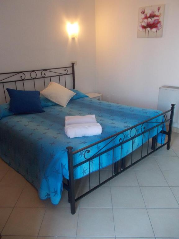Postel nebo postele na pokoji v ubytování Hotel Mastropeppe