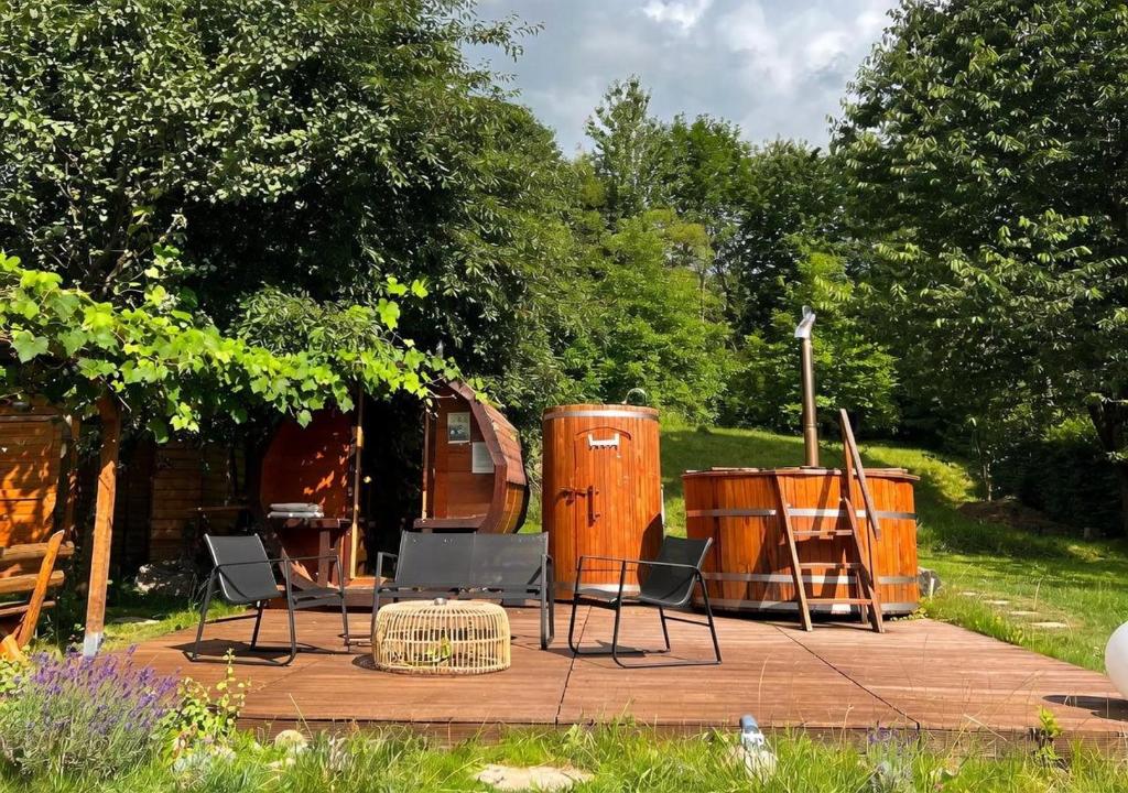 a deck with chairs and a table and a tent at Pensiunea MIS in Bran