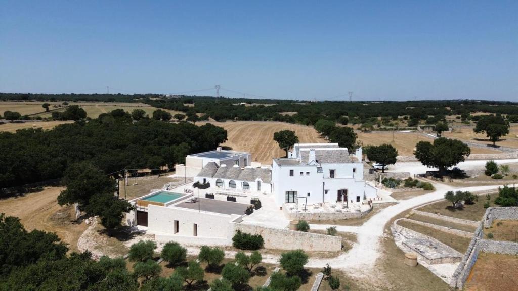 an aerial view of a large white house at Masseria Calandrella in Noci