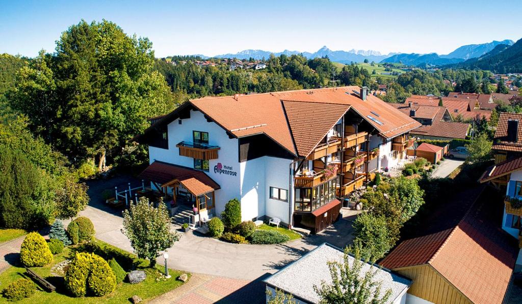 an aerial view of a building with a resort at Akzenthaus Alpenrose Nesselwang in Nesselwang