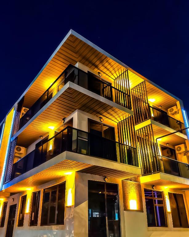 a large building with lights on it at night at Hotel Nika in Batumi
