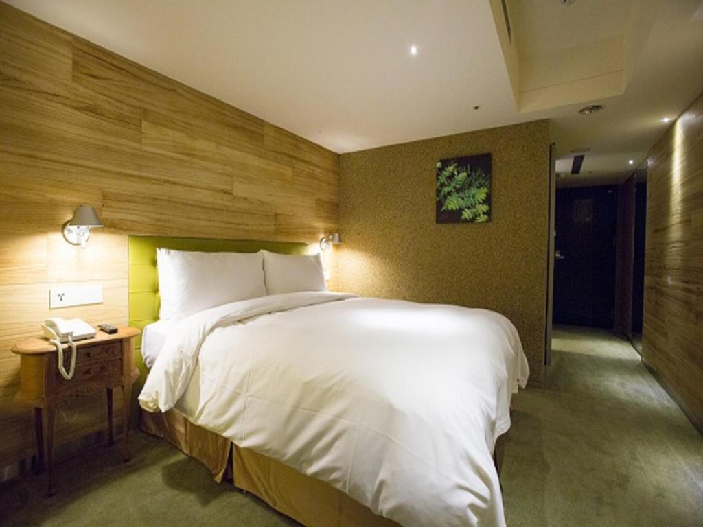 Postel nebo postele na pokoji v ubytování Inhouse Hotel Taichung