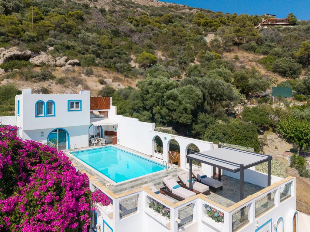 an aerial view of a villa with a swimming pool at ILIOS COVE by A&D Properties in Porto Rafti