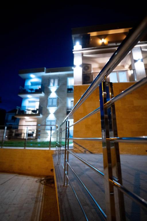 a view of a building at night with a staircase at Vivora Residence in Radovici