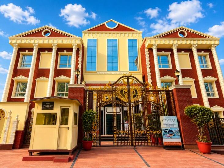 a large building with a gate in front of it at Hotel Cymbal -Sector 31 Gurgaon in Gurgaon