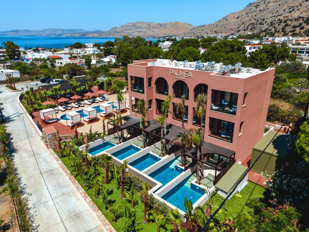 an aerial view of a resort with a swimming pool at Palmea Suites in Pefki