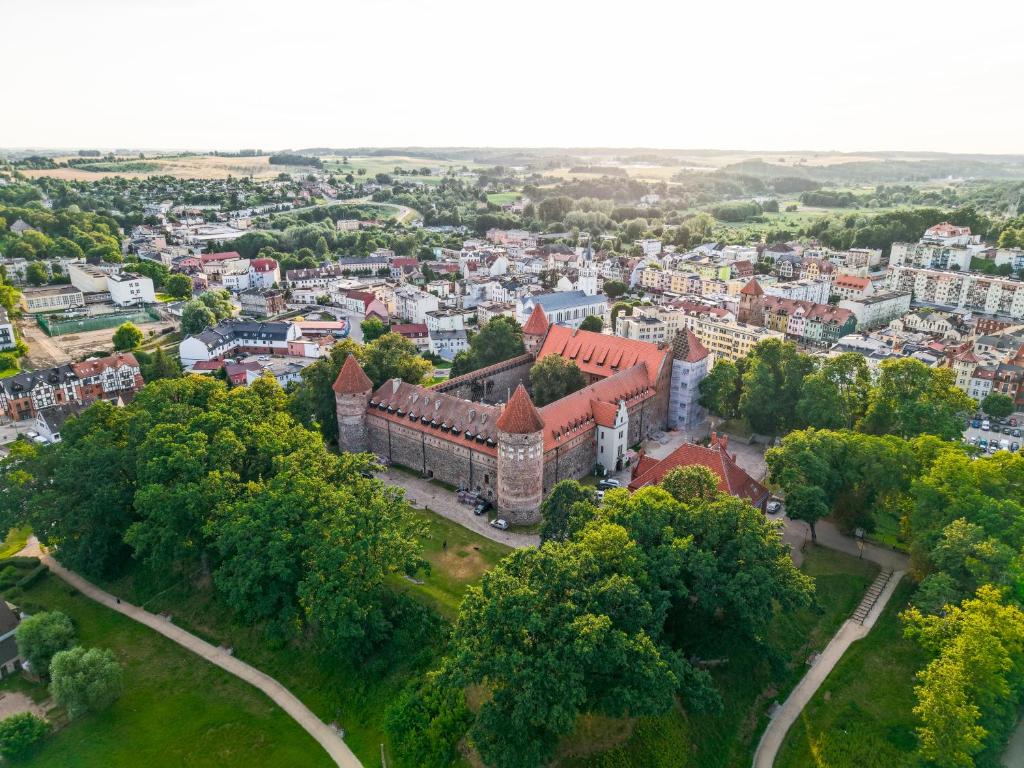 an aerial view of a castle in a city at Hotel&Restauracja Zamek Bytów in Bytów