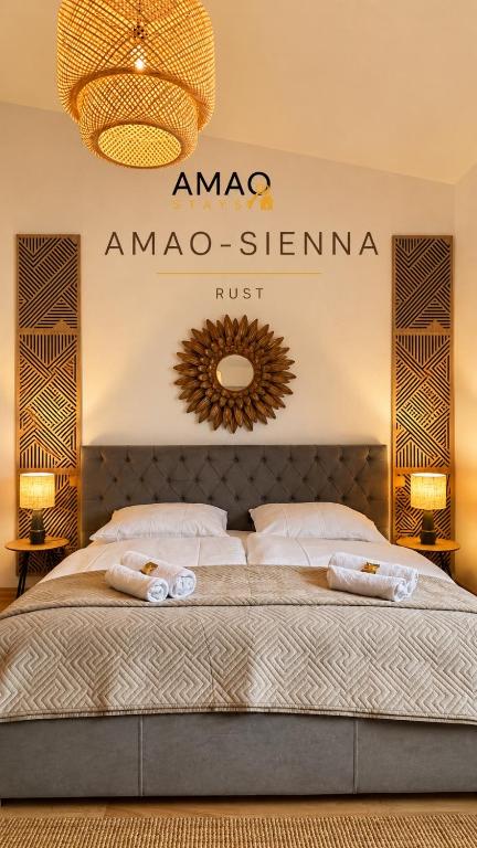a bedroom with a bed with aania sign on the wall at AMAO-Sienna - Walk to Europa-Park - Terrace - 6 Guests in Rust