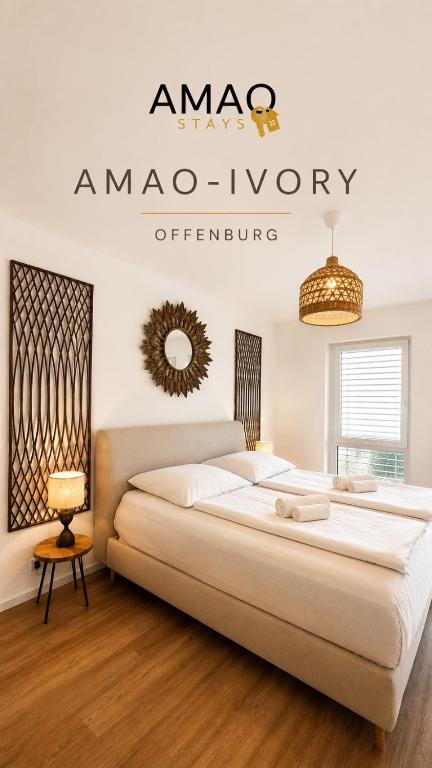 a bedroom with a large bed in a room at AMAO-Ivory - Business Apartment - 6 Guests - Parking in Offenburg