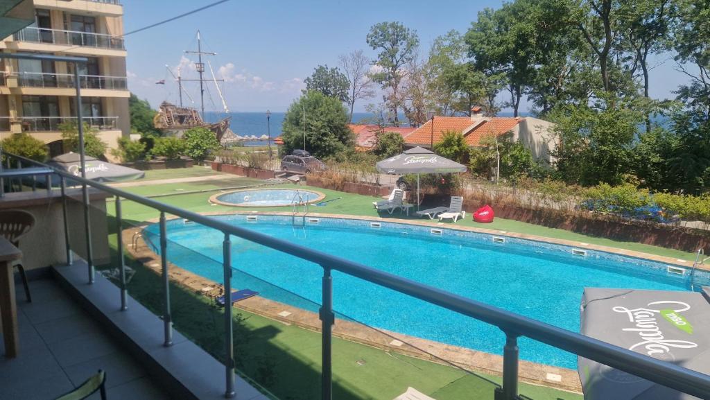 a view of a swimming pool from a balcony at Apart Complex Pontica - Sea View 20 in Chernomorets