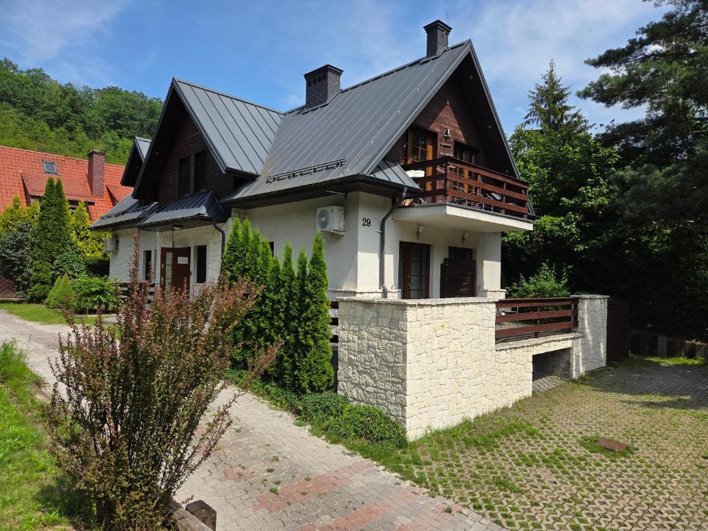 a house with a metal roof on top of it at Willa 4 Pory Roku in Kazimierz Dolny